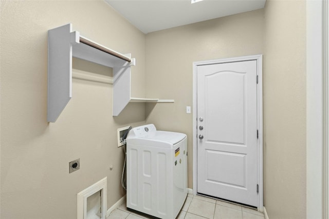 7420 Jaborandi Dr, Austin, TX 78739 - washroom with washer / dryer, light tile patterned flooring, and baseboards