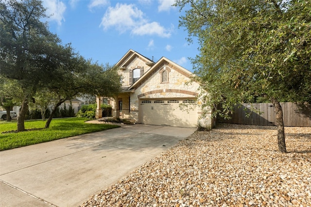 7420 Jaborandi Dr, Austin, TX 78739 - view of front of property with stone siding, driveway, and a garage