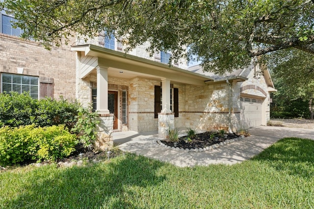 7420 Jaborandi Dr, Austin, TX 78739 - view of front of property featuring an attached garage, stone siding, driveway, and a porch