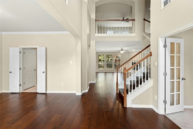 7420 Jaborandi Dr, Austin, TX 78739 - entryway with ceiling fan, stairs, baseboards, a towering ceiling, and crown molding