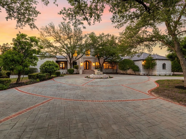 15902 Soleil Ct, Austin, TX 78734 - view of front of house with stone siding and curved driveway