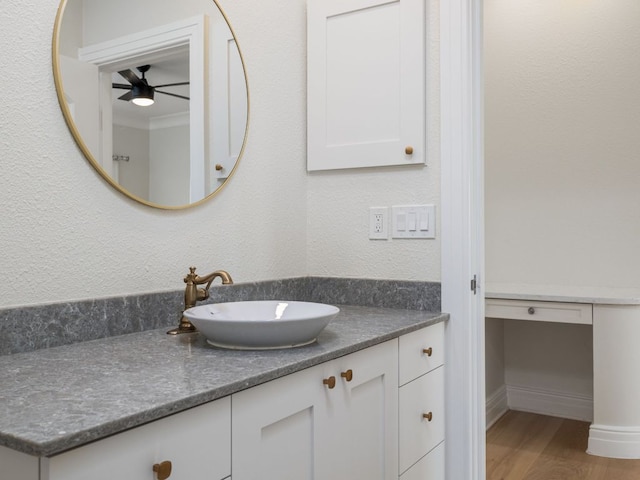 15902 Soleil Ct, Austin, TX 78734 - bathroom with a ceiling fan, vanity, and wood finished floors