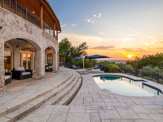 15902 Soleil Ct, Austin, TX 78734 - pool at dusk featuring a patio and french doors