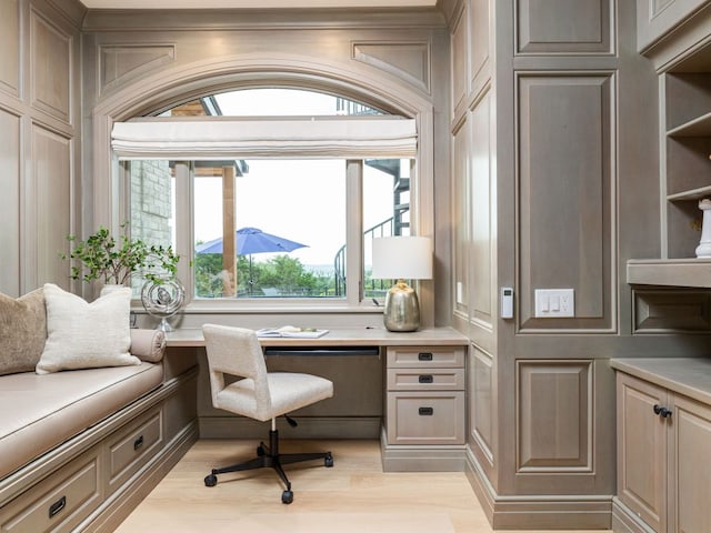 15902 Soleil Ct, Austin, TX 78734 - home office with built in desk, healthy amount of natural light, and light wood-type flooring