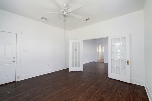 1205 E 12th St, Austin, TX 78702 - spare room featuring french doors, dark wood-style floors, ceiling fan, and baseboards