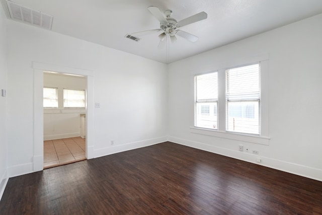 1205 E 12th St, Austin, TX 78702 - spare room with dark wood-type flooring and ceiling fan