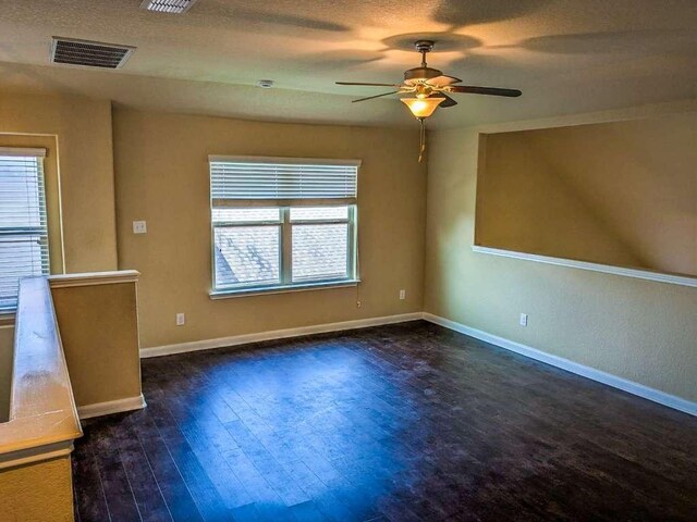 1226 Hidden Cave Dr, New Braunfels, TX 78132 - unfurnished living room with ceiling fan, wood finished floors, and baseboards