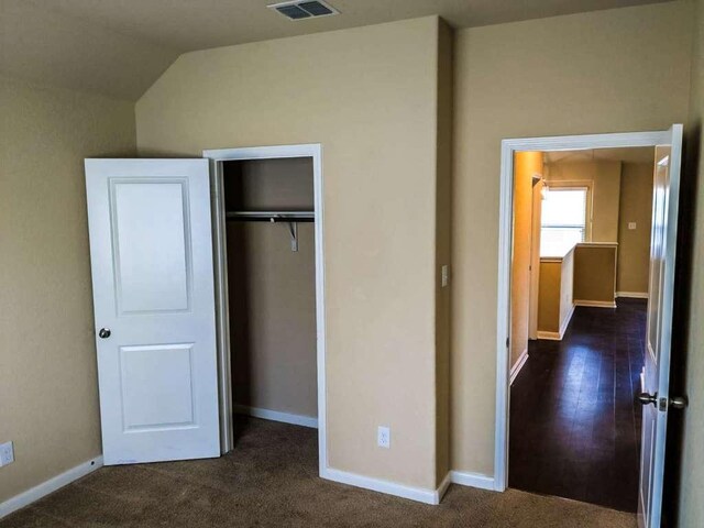 1226 Hidden Cave Dr, New Braunfels, TX 78132 - unfurnished bedroom featuring a closet, lofted ceiling, and baseboards