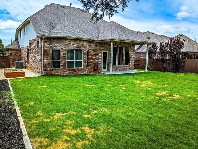 1226 Hidden Cave Dr, New Braunfels, TX 78132 - back of house featuring a patio, cooling unit, brick siding, and a shingled roof