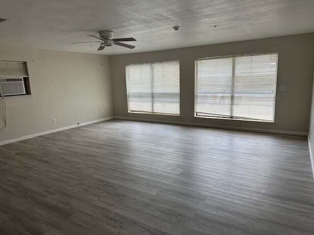 1412 Ocotilla Dr, Marble Falls, TX 78654 - unfurnished room featuring a ceiling fan, baseboards, and wood finished floors