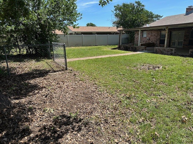1412 Ocotilla Dr, Marble Falls, TX 78654 - view of yard featuring french doors