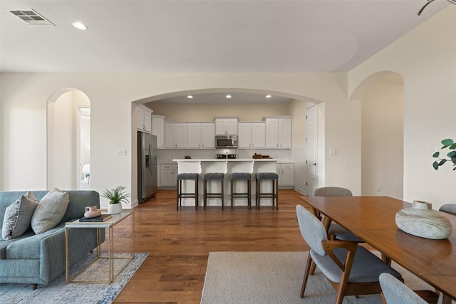 20213 Hidden Gully Ln, Pflugerville, TX 78660 - living room featuring dark wood-style flooring, recessed lighting, and baseboards