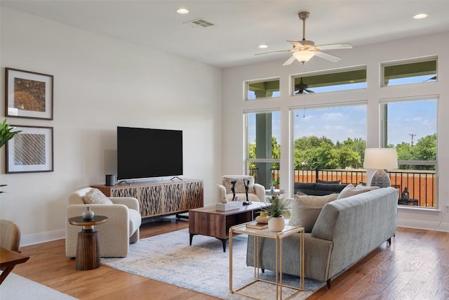 20213 Hidden Gully Ln, Pflugerville, TX 78660 - living room featuring ceiling fan, wood finished floors, baseboards, and recessed lighting