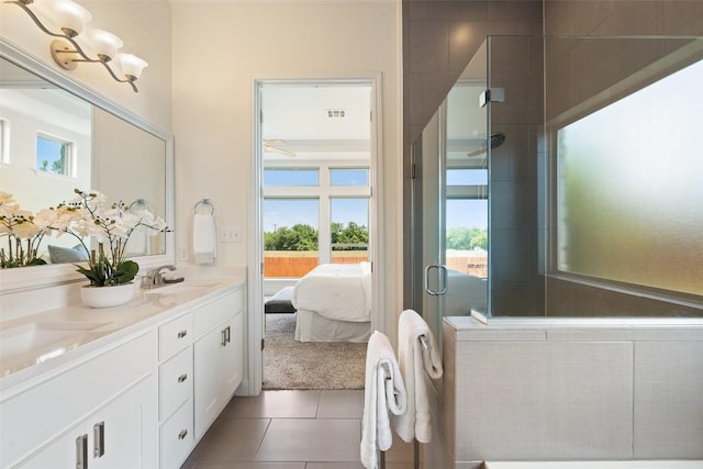 20213 Hidden Gully Ln, Pflugerville, TX 78660 - full bathroom featuring double vanity, ensuite bath, plenty of natural light, and tile patterned floors