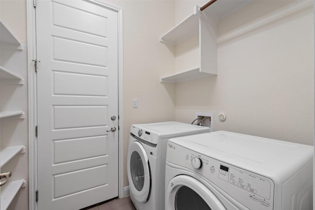 20213 Hidden Gully Ln, Pflugerville, TX 78660 - laundry area with independent washer and dryer and tile patterned flooring
