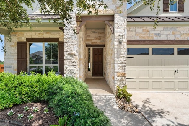 20213 Hidden Gully Ln, Pflugerville, TX 78660 - property entrance with stone siding, a standing seam roof, a garage, and metal roof