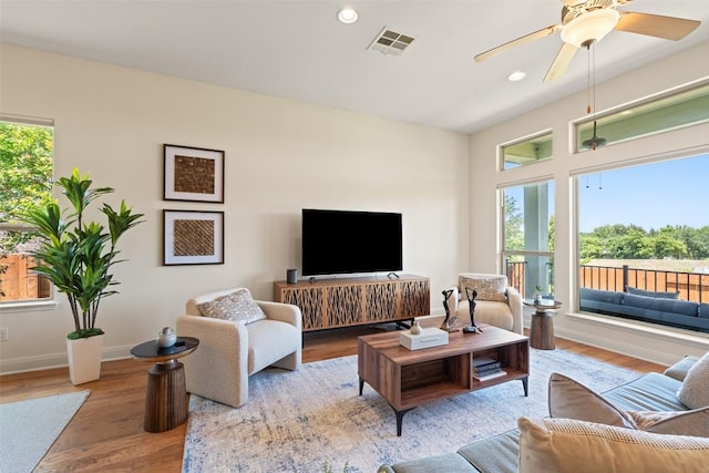 20213 Hidden Gully Ln, Pflugerville, TX 78660 - living room featuring wood finished floors, recessed lighting, ceiling fan, and baseboards