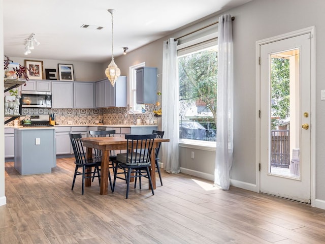 12705 Bransford Cv, Austin, TX 78753 - dining area with light wood-type flooring and baseboards