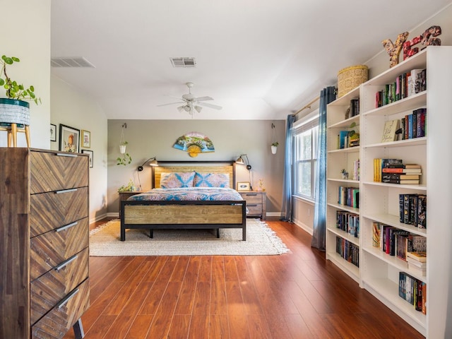 12705 Bransford Cv, Austin, TX 78753 - bedroom with wood finished floors, baseboards, and a ceiling fan