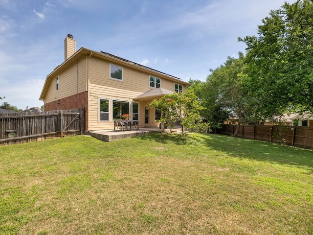 12705 Bransford Cv, Austin, TX 78753 - back of house featuring a chimney and a patio