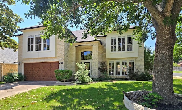 view of front of house featuring stone siding, a front lawn, concrete driveway, a garage, and brick siding