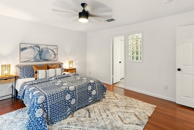 12707 Palfrey Dr, Austin, TX 78727 - bedroom with wood finished floors, baseboards, and a ceiling fan