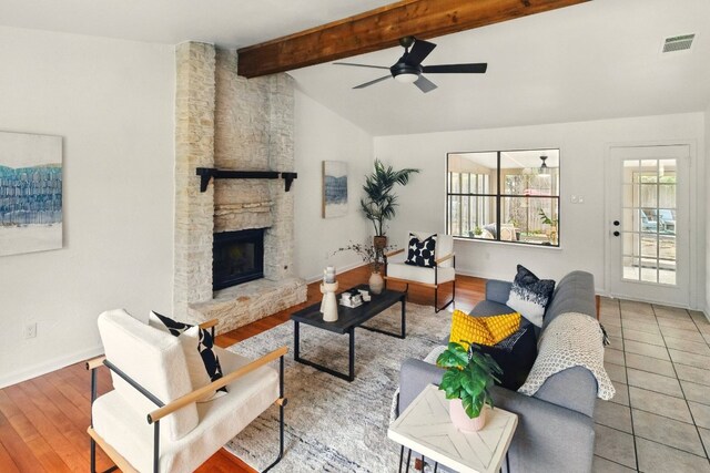 12707 Palfrey Dr, Austin, TX 78727 - living area with ceiling fan, baseboards, a fireplace, and wood finished floors