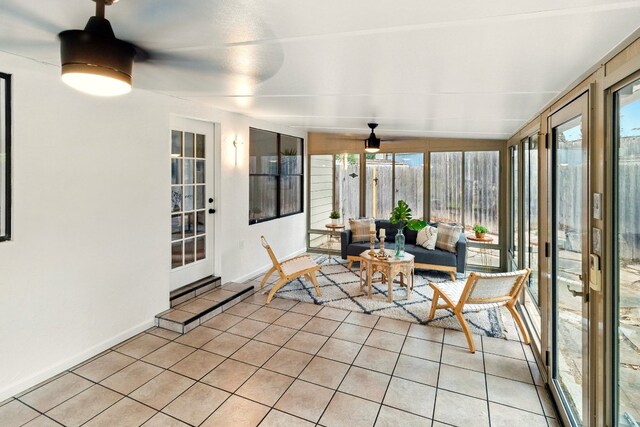 12707 Palfrey Dr, Austin, TX 78727 - sunroom / solarium featuring tile patterned floors, plenty of natural light, and baseboards