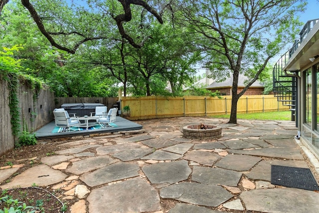 12707 Palfrey Dr, Austin, TX 78727 - fenced backyard with a hot tub, a fire pit, a patio, and a deck