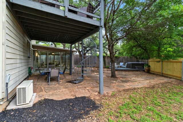 12707 Palfrey Dr, Austin, TX 78727 - fenced backyard featuring a hot tub and a patio area