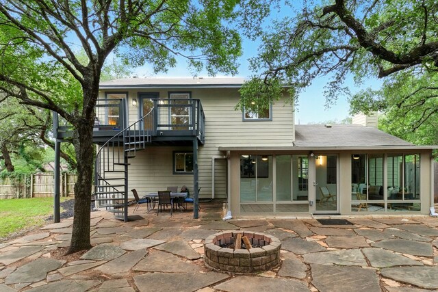 12707 Palfrey Dr, Austin, TX 78727 - rear view of property with an outdoor fire pit, stairway, a patio area, a chimney, and outdoor dining space
