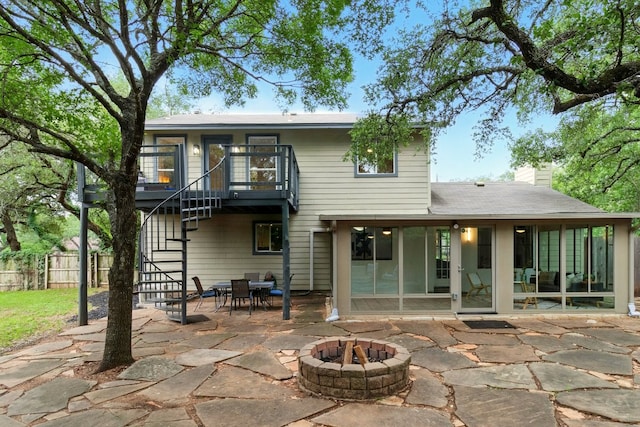 12707 Palfrey Dr, Austin, TX 78727 - rear view of house featuring a fire pit, stairs, a patio, a chimney, and outdoor dining area
