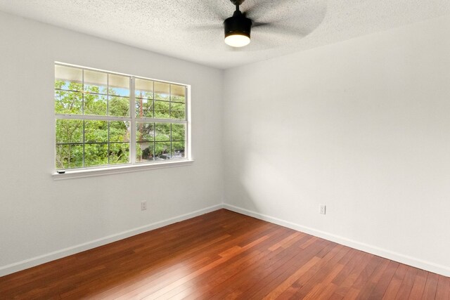 12707 Palfrey Dr, Austin, TX 78727 - empty room featuring hardwood / wood-style floors, a ceiling fan, baseboards, and a textured ceiling