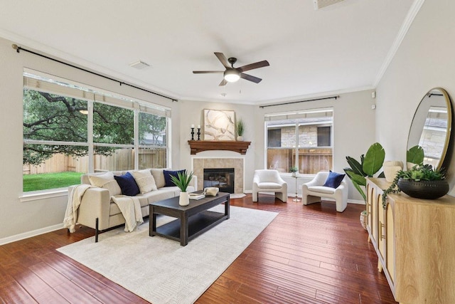 10113 Cassandra Dr, Austin, TX 78717 - living area with crown molding, ceiling fan, a fireplace, baseboards, and dark wood-type flooring