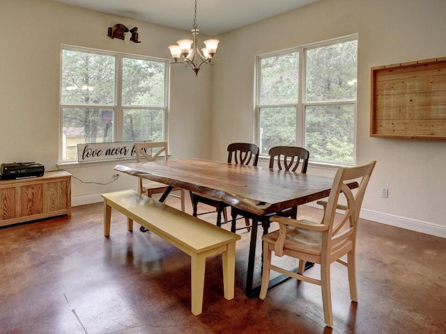 247 Campfire Way, Smithville, TX 78957 - dining room featuring healthy amount of natural light, a chandelier, and baseboards