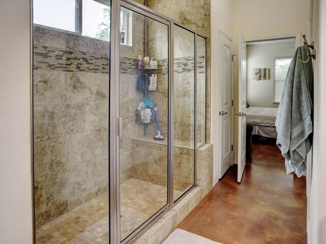 247 Campfire Way, Smithville, TX 78957 - ensuite bathroom featuring a shower stall and concrete flooring