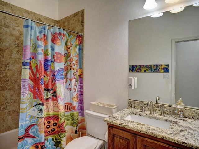 247 Campfire Way, Smithville, TX 78957 - bathroom with vanity, toilet, and shower / bathtub combination with curtain