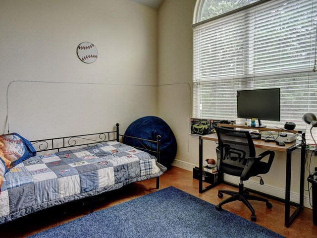 247 Campfire Way, Smithville, TX 78957 - bedroom with an office area and baseboards