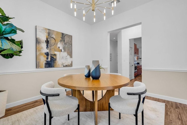 1055 Sunflower Trl, Austin, TX 78745 - dining room featuring wood finished floors, baseboards, and a chandelier