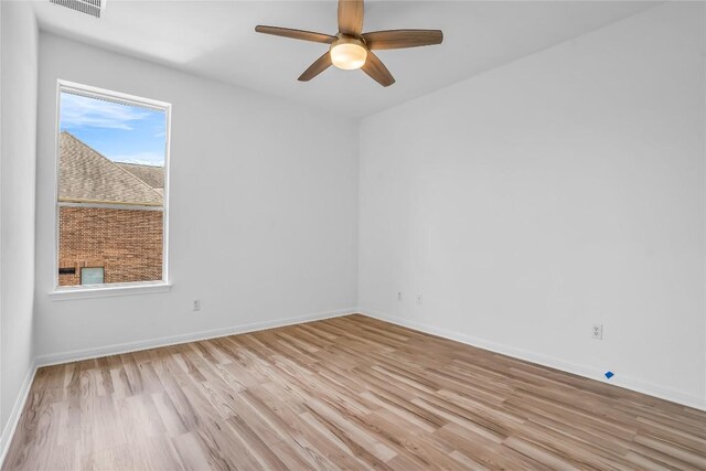 1055 Sunflower Trl, Austin, TX 78745 - unfurnished room featuring light wood-style flooring and a ceiling fan