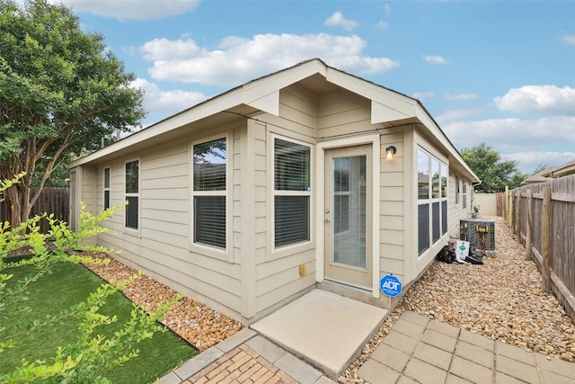 238 Rock Bluff Ln, San Marcos, TX 78666 - view of home's exterior featuring a fenced backyard and a patio area