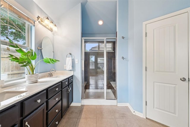 238 Rock Bluff Ln, San Marcos, TX 78666 - bathroom with double vanity, plenty of natural light, tile patterned flooring, and a shower with shower door