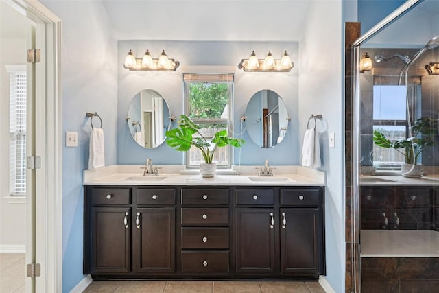 238 Rock Bluff Ln, San Marcos, TX 78666 - bathroom featuring double vanity, tile patterned flooring, and a tile shower