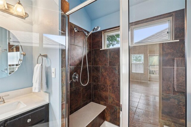 238 Rock Bluff Ln, San Marcos, TX 78666 - bathroom with a stall shower, vanity, and tile patterned floors