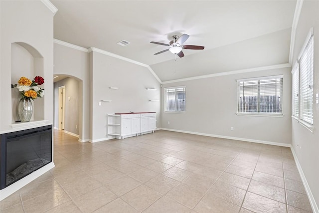 238 Rock Bluff Ln, San Marcos, TX 78666 - unfurnished living room with light tile patterned floors, a ceiling fan, arched walkways, ornamental molding, and vaulted ceiling