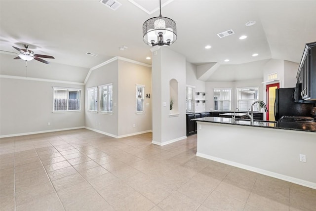 238 Rock Bluff Ln, San Marcos, TX 78666 - kitchen featuring vaulted ceiling, ceiling fan, dark countertops, open floor plan, and a peninsula