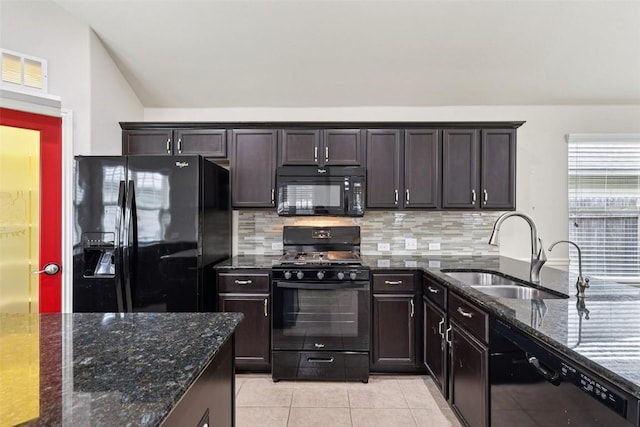 238 Rock Bluff Ln, San Marcos, TX 78666 - kitchen featuring black appliances, decorative backsplash, dark stone countertops, light tile patterned flooring, and dark brown cabinetry