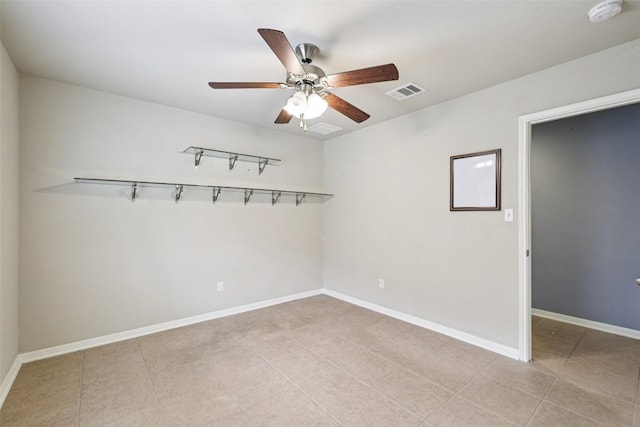 238 Rock Bluff Ln, San Marcos, TX 78666 - spare room with a ceiling fan, light tile patterned floors, and a smoke detector