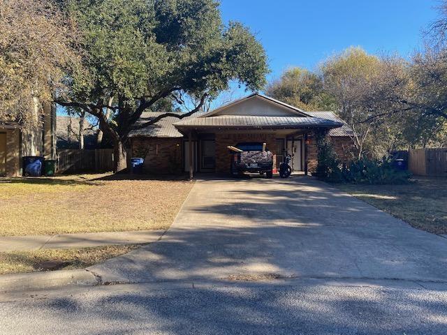 1402 Waterloo Trl, Austin, TX 78704 - view of front of property with concrete driveway and a carport
