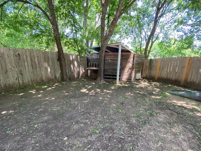 1402 Waterloo Trl, Austin, TX 78704 - fenced backyard with an outdoor structure